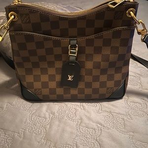 Almost new . Recent purchase , carried once .receipt , box and shopping bag .